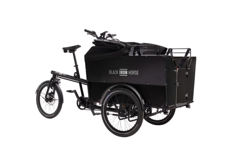 Front right view of the the Black Iron Horse OX cargo bike with the rain cover down